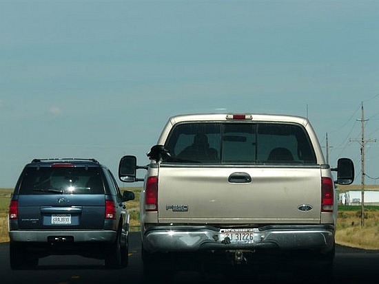 The dog loves to bark at other vehicles